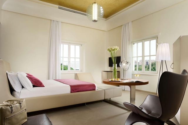 Palazzo Montemartini business suite with workspace for luxury corporate travel and VIP events.