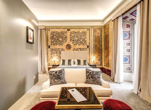 Luxury hotel suite with historic architecture, perfect for VIP accommodations and executive events.