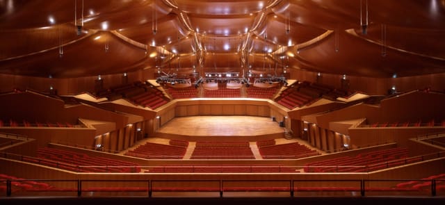 Spazio Risonanze auditorium with acoustic design for professional keynote and plenary events.