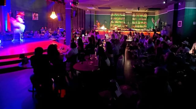 Live Dinner Club venue with cabaret seating for corporate events and evening entertainment.