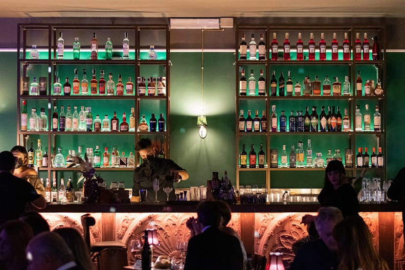 Emerald green bar at Ellington Club, perfect for corporate receptions and networking events.