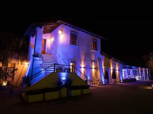 Villa Parco della Vittoria entrance hall with architectural uplighting for gala receptions.