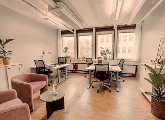 Coworking space at 7A Odenplan featuring workstations and lounge seating for office events.
