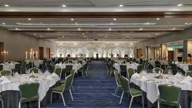 Ballroom banquet setup with candelabras, perfect for corporate galas or wedding receptions.