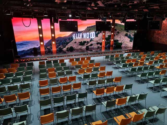 Tech-forward Gyllene Salen stage with LED backdrop for corporate keynotes and brand activations.