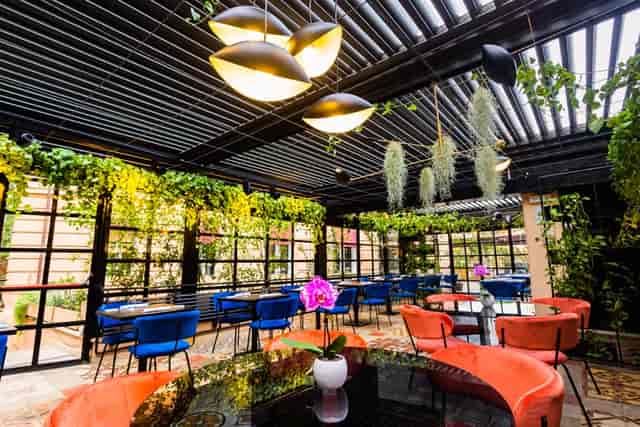 Biophilic event space at The Corner Roma with louvered ceiling for cocktail receptions or mixers.