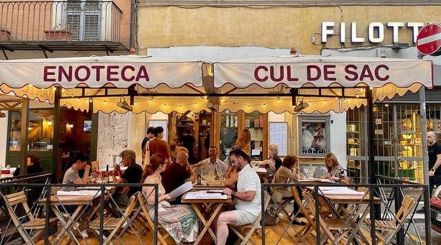Wine bar street-side setup in Palazzo Navona for networking receptions and corporate dinners.