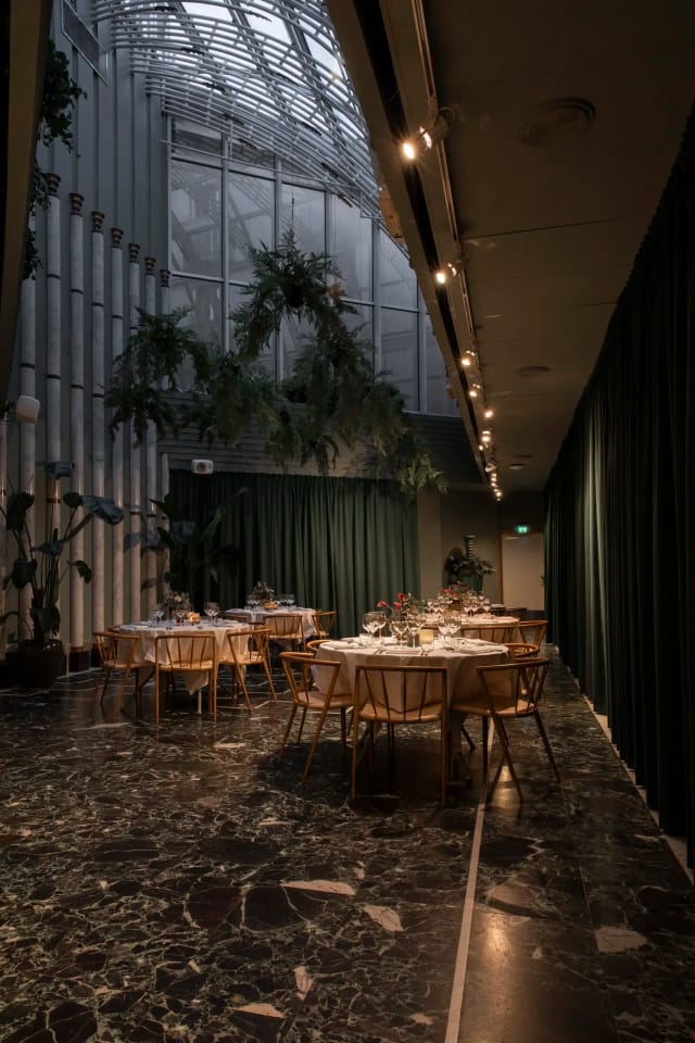 Upscale dining setup at Kammarsalen with mood lighting for gala dinners or networking events.