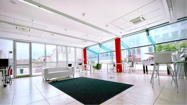 Area 211 breakout space in Newton Factory with modular furniture for workshops and networking.