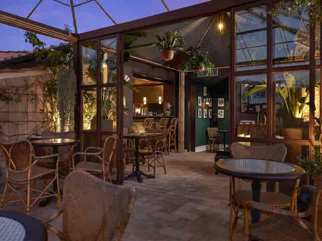 Palatine Terrace rooftop: biophilic cocktail lounge for corporate events and conference breakouts.