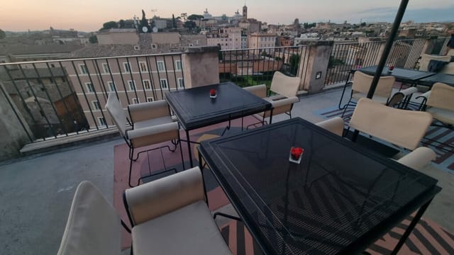 Rooftop terrace in Rome with panoramic skyline for VIP cocktail events and networking receptions.