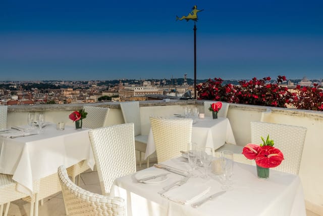 Upscale rooftop bar in Rome with panoramic views for VIP receptions and gala dinners.
