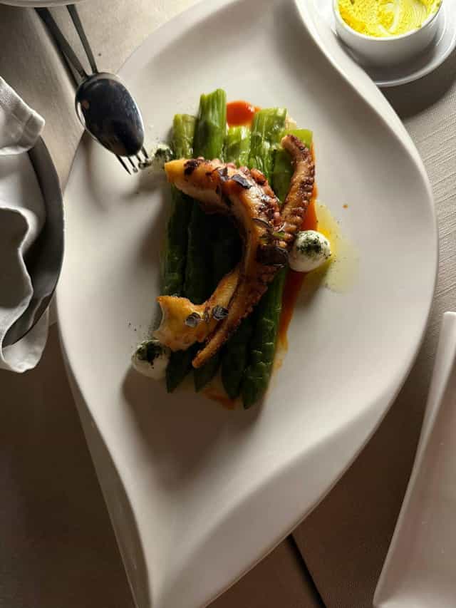 Grilled octopus entrée at I Sofà Bar roof terrace, perfect for gala dinner or executive luncheon.