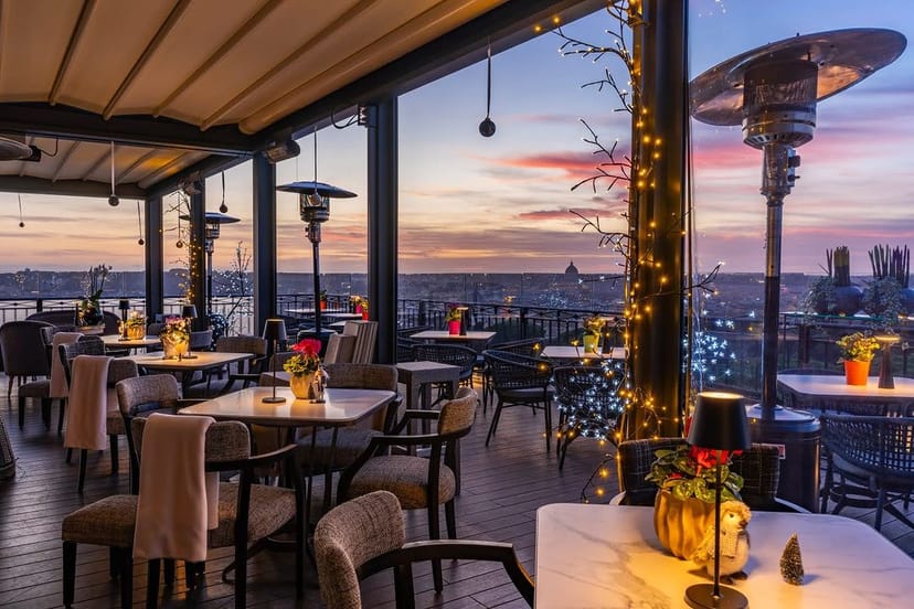 Rooftop terrace at Ristorante Mirabelle with ambient lighting for corporate mixers and networking.