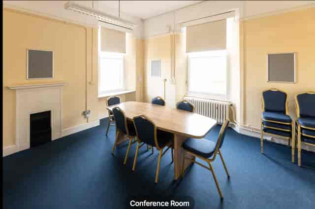 Main Hall breakout room with oval table for informal meetings and small event workshops.