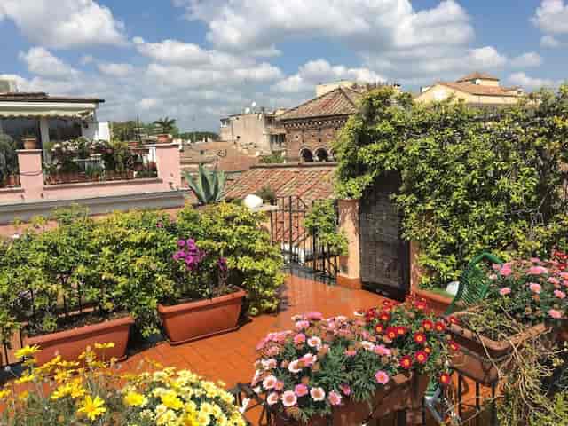 Rooftop terrace garden venue in Rome for intimate networking and boutique cocktail events.