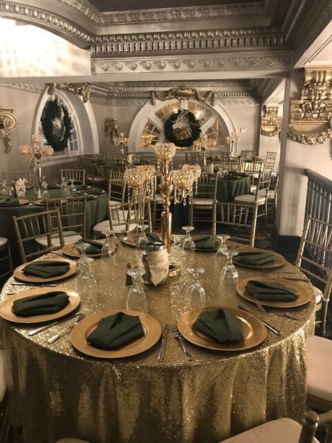 Gala conference center with gold sequin linens and crystal centerpieces for formal events.