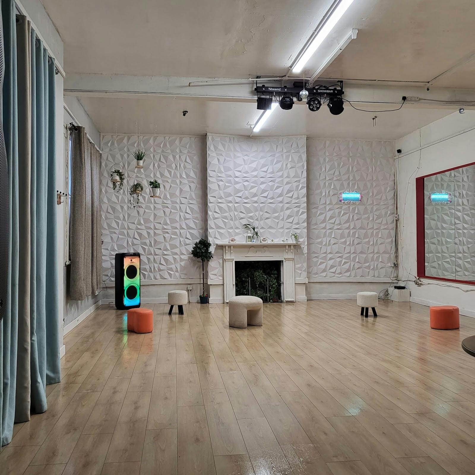 Modern multi-purpose flex space with accent walls for workshops and dance studio venue hire.