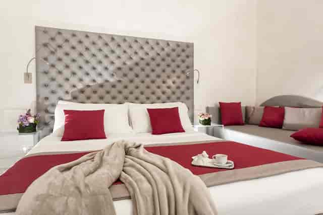 Luxury hotel room with tufted headboard, perfect for VIP accommodations and corporate events.