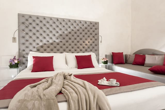 Luxury hotel room with tufted headboard, perfect for VIP accommodations and corporate events.