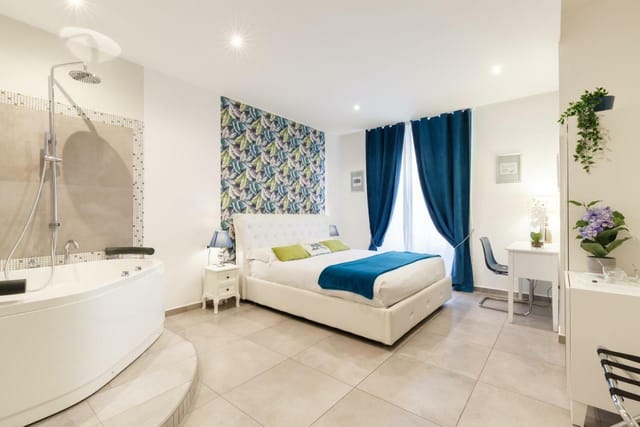 Omnia Superior hotel room with open-concept soaking tub for luxury travel and boutique stays.