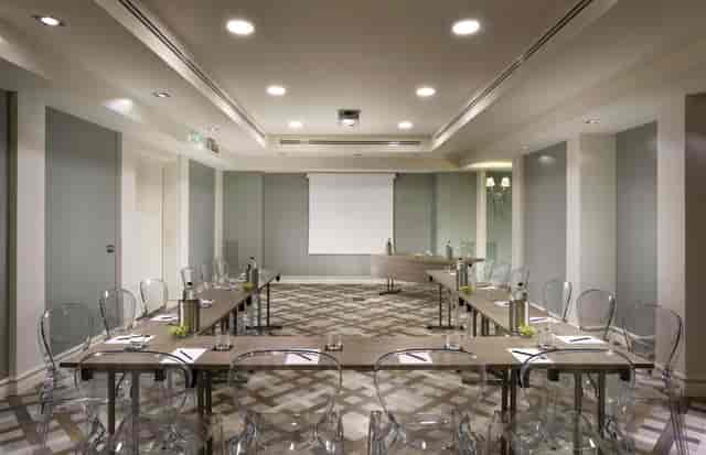 U-shape boardroom at Leon's Place with modern chairs for corporate meetings and presentations.