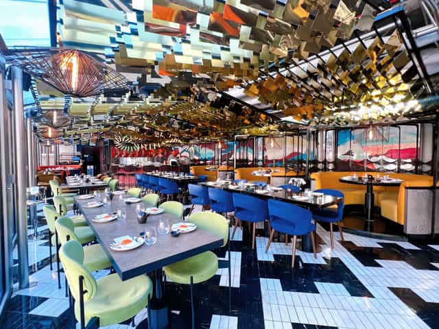 Vibrant SUSHISAMBA Covent Garden restaurant ideal for group events, featuring colorful seating.