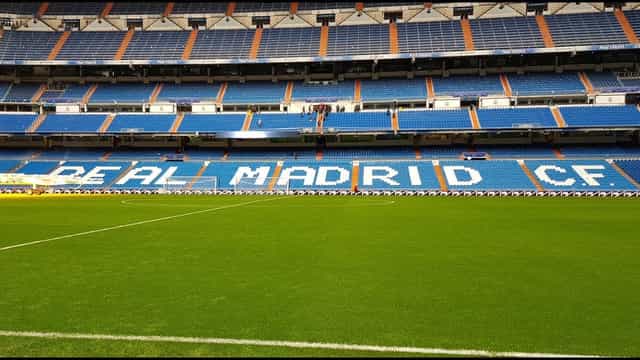 Bernabéu Stadium pitch for large-scale event venue and corporate keynote branding.