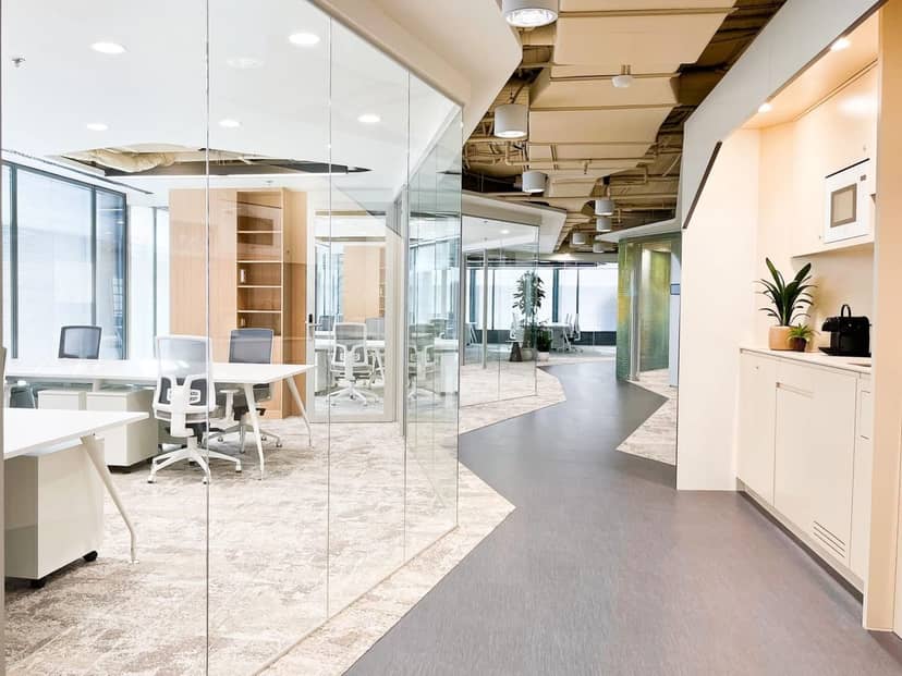 Modern LOOM Azca meeting room with glass partitions for hybrid workspace and team collaboration.