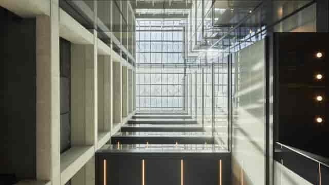 Modern reception at LOOM Azca terrace with high-ceilinged atrium for networking event venues.