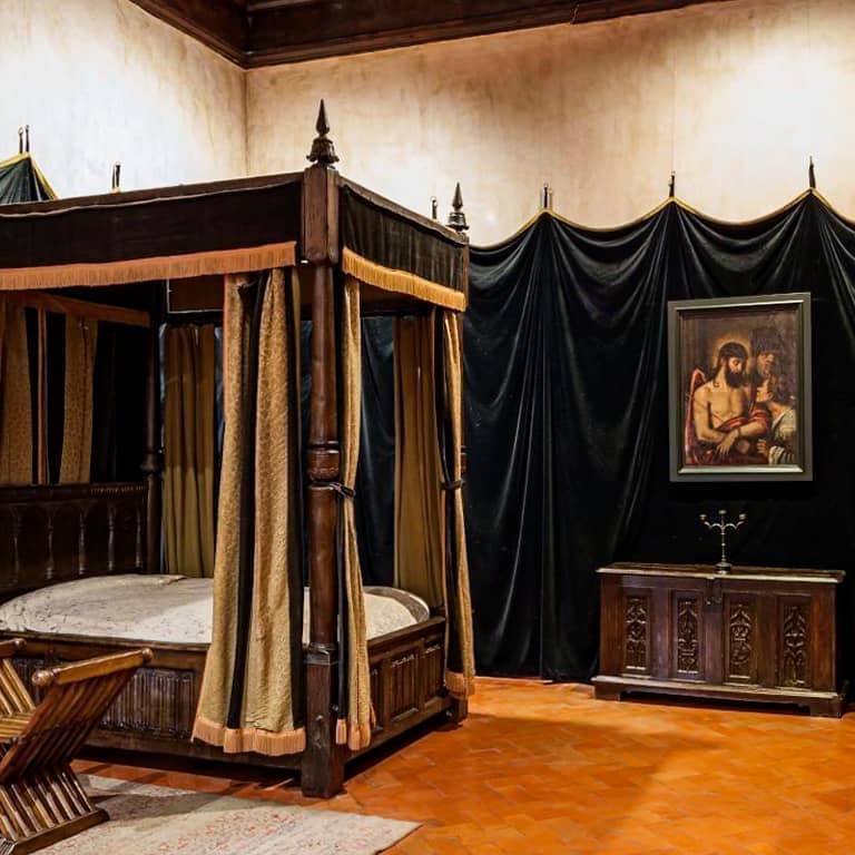 Charles V Bedroom at Yuste Monastery, dramatic staging design for immersive gala events.