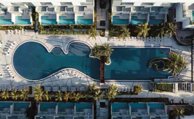 Hotel Catalonia Grand Costa Mujeres luxury resort pool deck for incentive travel and retreats.