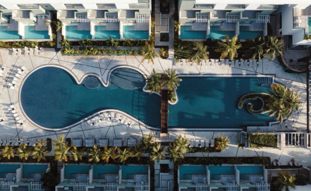 Hotel Catalonia Grand Costa Mujeres luxury resort pool deck for incentive travel and retreats.