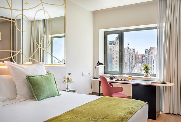 Luxury suite with city view and workspace for business travel and corporate events.