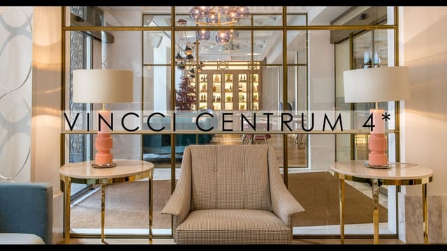 Vincci Centrum hotel lobby with glass partitions for small group networking and corporate events.