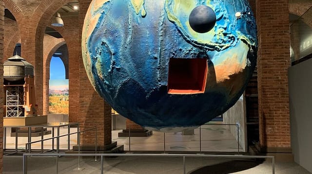 Industrial-chic Fundación Canal venue with sculptural art for product launches and networking events.