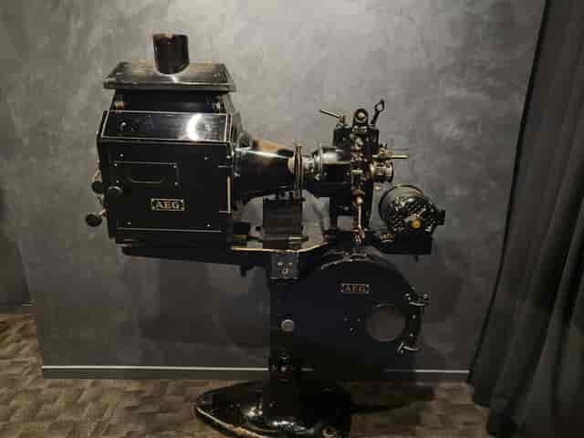 Antique AEG cinema projector at Teatro Goya, vintage event decor for corporate or film events.