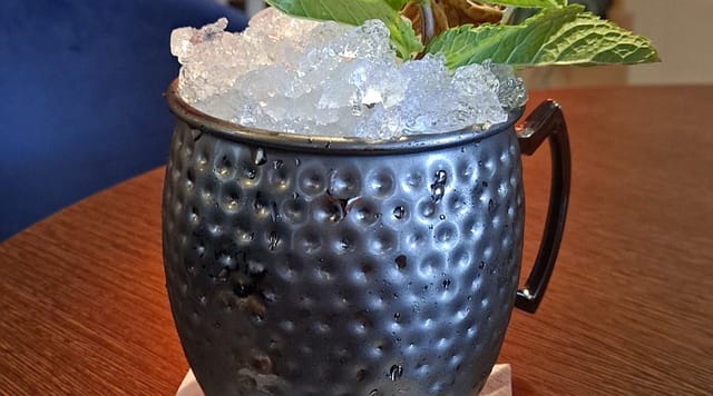 Moscow Mule cocktail in copper mug at Tempo Club networking event.