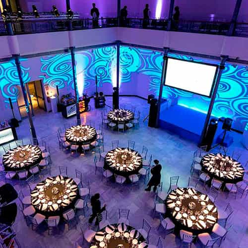 Sala Polivalente gala dining venue with architectural projection mapping for corporate events.