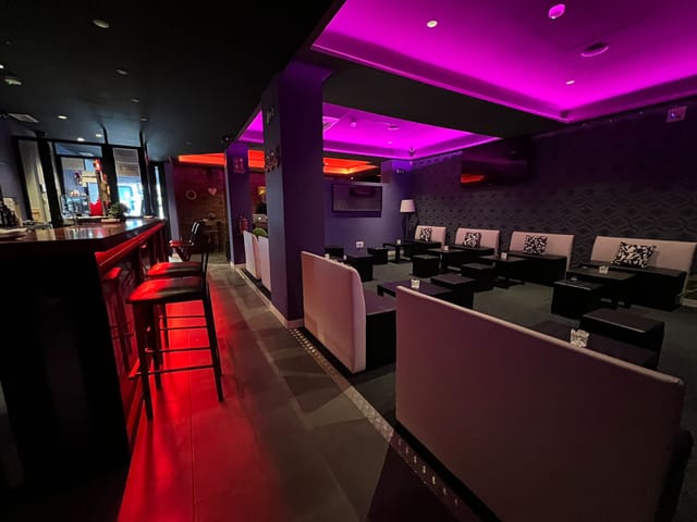 Modern function room lounge with banquette seating for VIP receptions and networking events.