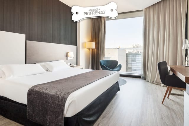 Modern business hotel room with workspace for bleisure travel and corporate events.