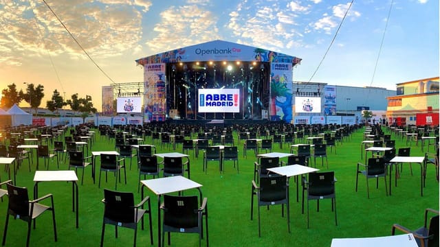 Socially-distanced open-air stage at IFEMA MADRID for corporate events and outdoor conferences.