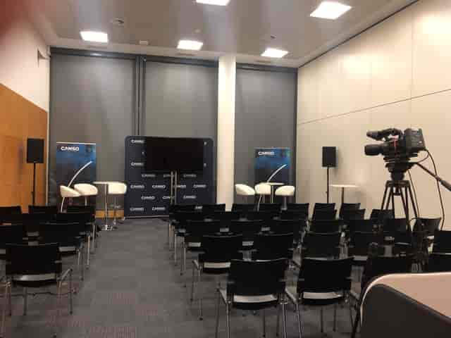 IFEMA Madrid breakout room with theater seating for panel discussion and professional AV equipment.