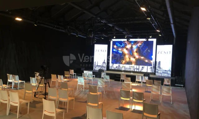 Industrial event space with LED wall for corporate product launches and presentations.
