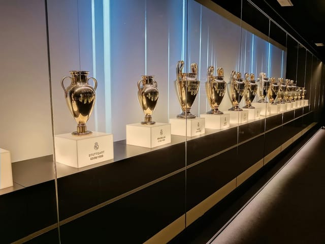 Palco de Honor at Santiago Bernabéu: illuminated trophy display for VIP corporate events.