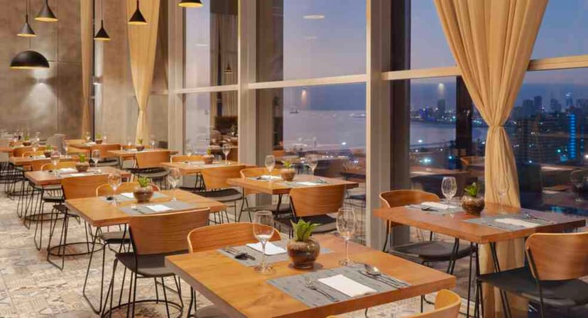 High-end meeting room with floor-to-ceiling windows for corporate dinner and networking events.