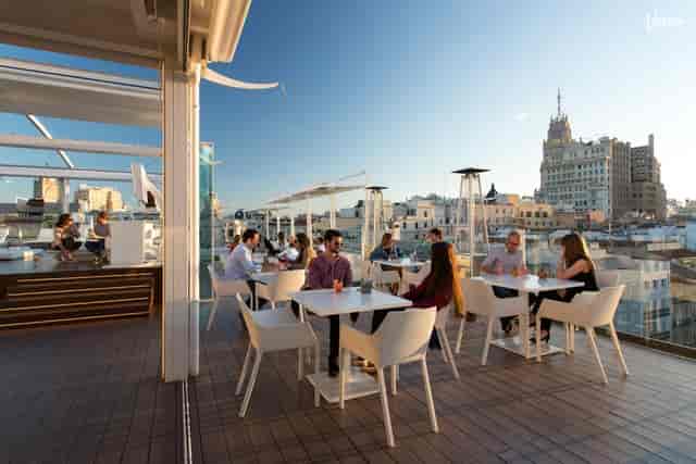 Rooftop terrace with skyline views for corporate cocktail hours and networking events.