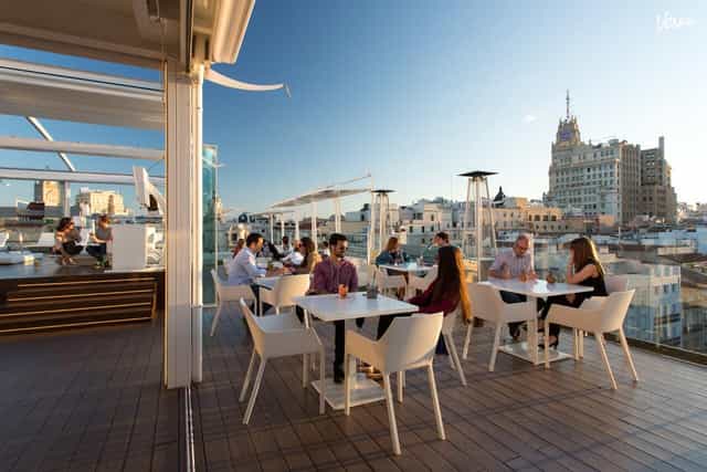 Rooftop terrace with skyline views for corporate cocktail hours and networking events.