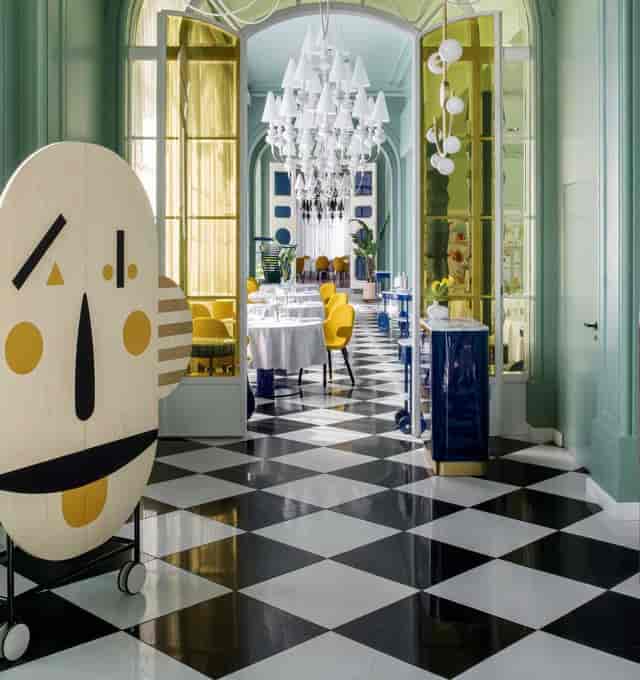 Paco Roncero Restaurante: High-end banquet space with checkerboard floors for corporate luncheons.