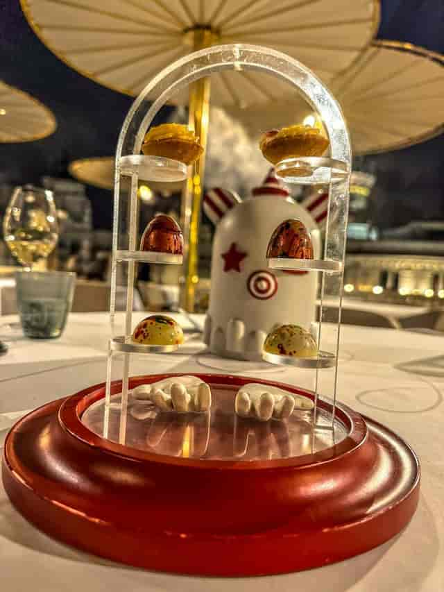 Whimsical F&B presentation on luxury restaurant terrace for incentive dinners and networking.